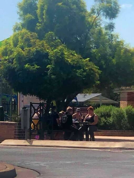 This group across from Woolworths were not adhering to social distancing rules. Photo: Kourtney Grace