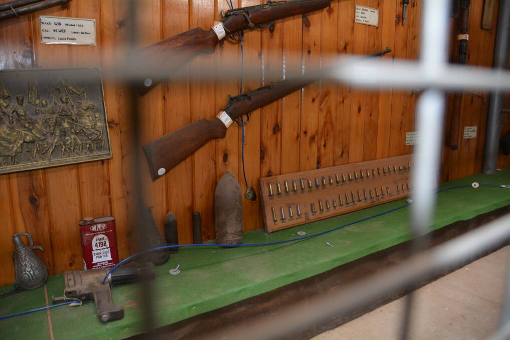 Historical firearms used to line the length of the green bench before they were removed to follow the new laws. Photo: Jessica Worboys