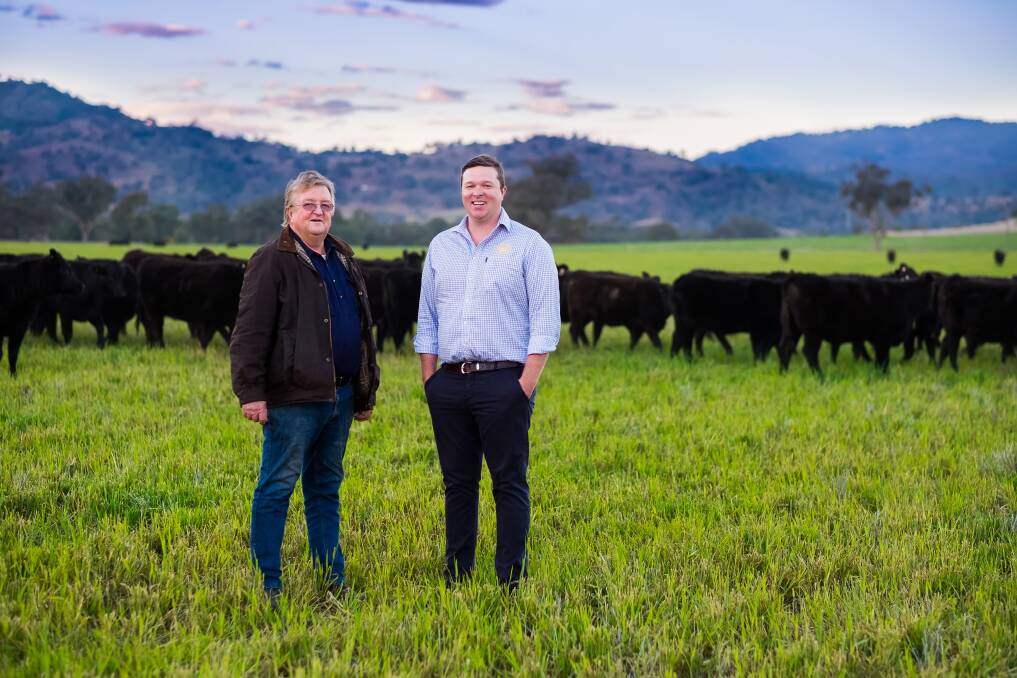 Patrick Warmoll, right, with his father Phillip Warmoll on their property. Photo: supplied