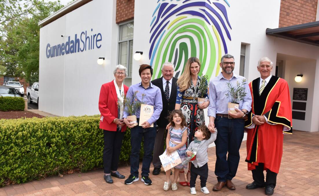 Gunnedah's councillors welcome the da Silva family and Mr Vong as Australian citizens in a ceremony on Australian Citizenship Day. Photo: Marie Low