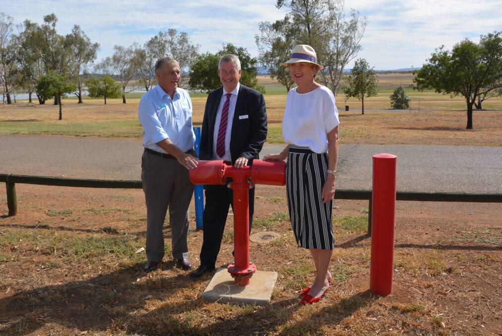 MITIGATING THREATS: Rob Hooke, Steve Edmonds and Wendy Machen with one of the new hydrants at Lake Keepit. Photo: Jessica Worboys