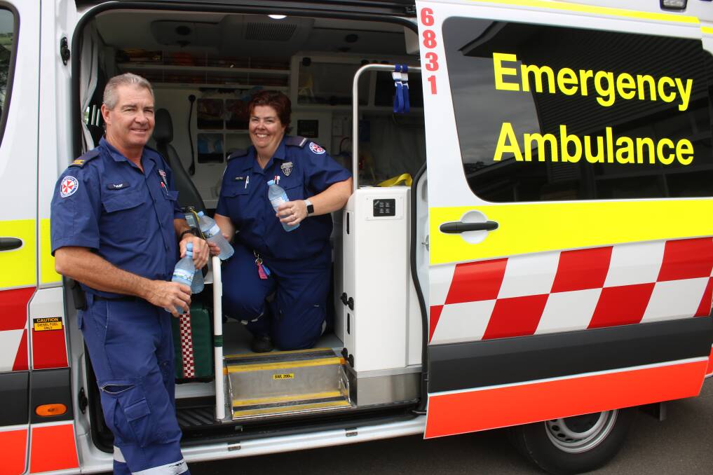 KEEP CALM AND DRINK WATER: Intensive care paramedic Peter Patterson and paramedic Hayley Hausfeld say water is the best way to stay hydrated. Photo: Jessica Worboys