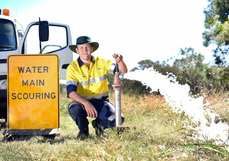 LPSC's water services team member Ian Martin preparing for the water flushing exercise in Werris Creek. Photo: Sally Alden Photography