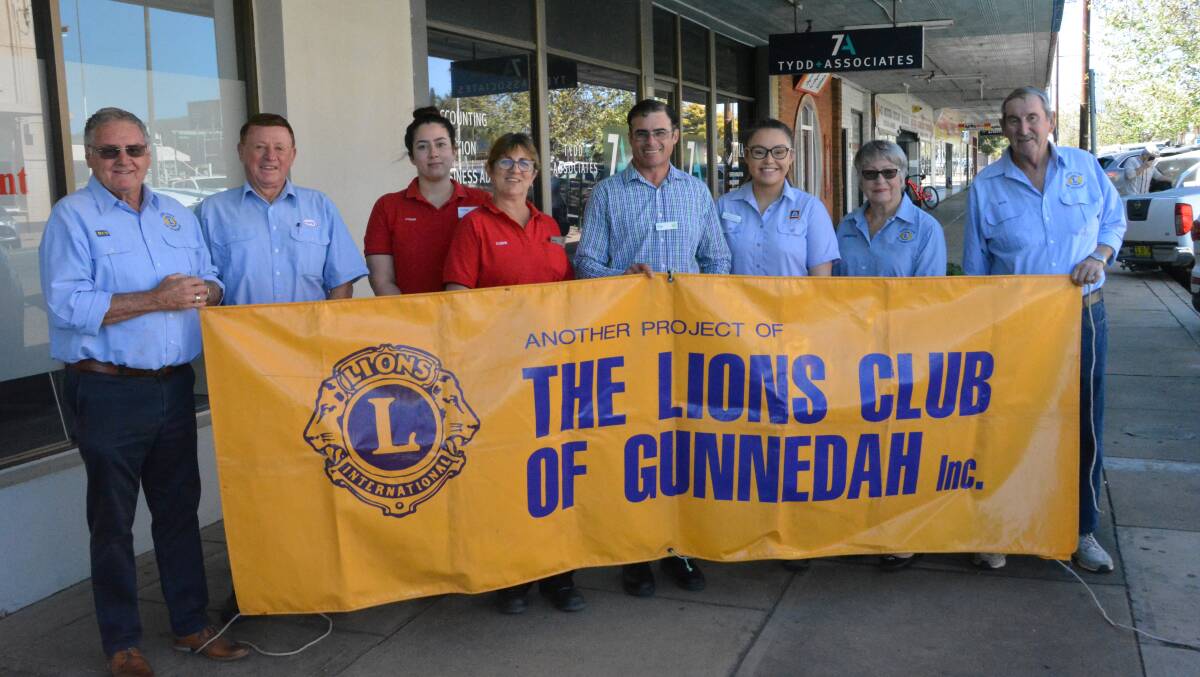 Lions Club of Gunnedah's Nev Adams, Jennifer Bower and Bob Carter with, from left to right, Hope's Fuel Supplies' Paul Hope, Coles' Kerry Wise and Chelsea Mudaliar, Woolworths store manager Clay Dawson and Aldi's Marie-Ann Collits. Photo: Jessica Worboys