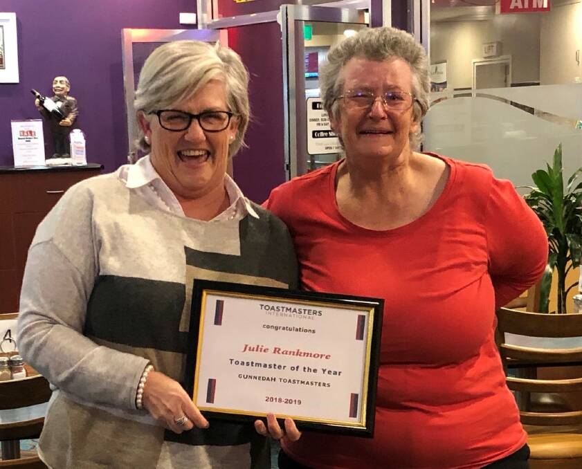 Gunnedah Toastmasters president Ange McCormack presents an emotional Julie Rankmore with the Toastmaster of the Year award. Photo: supplied