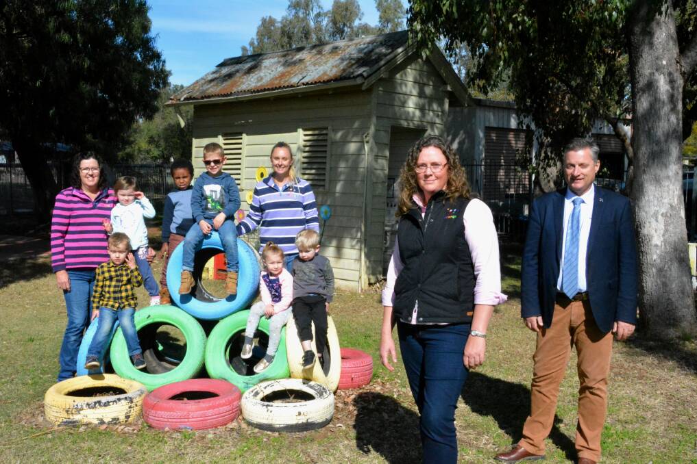 Ooranga's Helen Stevenson, Tiffany Guinery and executive officer Rebecca Dridan with Gunnedah mayor Jamie Chaffey and some Curlewis preschool kids. The bathroom is pictured in the background. Photo: Jessica Worboys