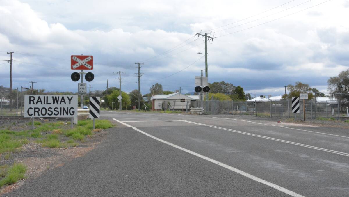 NOT A PRIORITY: The Carroll Street railway crossing currently has no boom gates, only flashing lights. Photo: Jessica Worboys