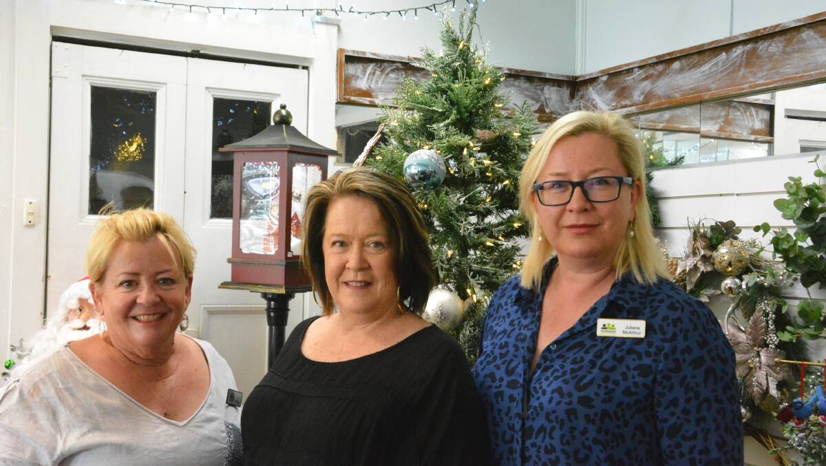 CHRISTMAS CHEER: Gunnedah Chamber of Commerce's Tracie Finlay and Juliana McArthur with Goodness and Gracious' Leanne Smith. Photo: Jessica Worboys