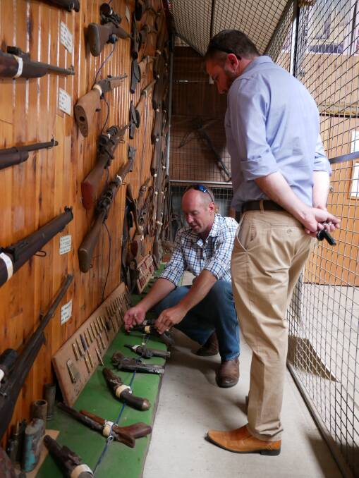 Gunnedah Rural Museum's Trent Donoghue shows Shooters, Fishers and Farmers party's Jeff Bacon the large collection of firearms. Photo: supplied