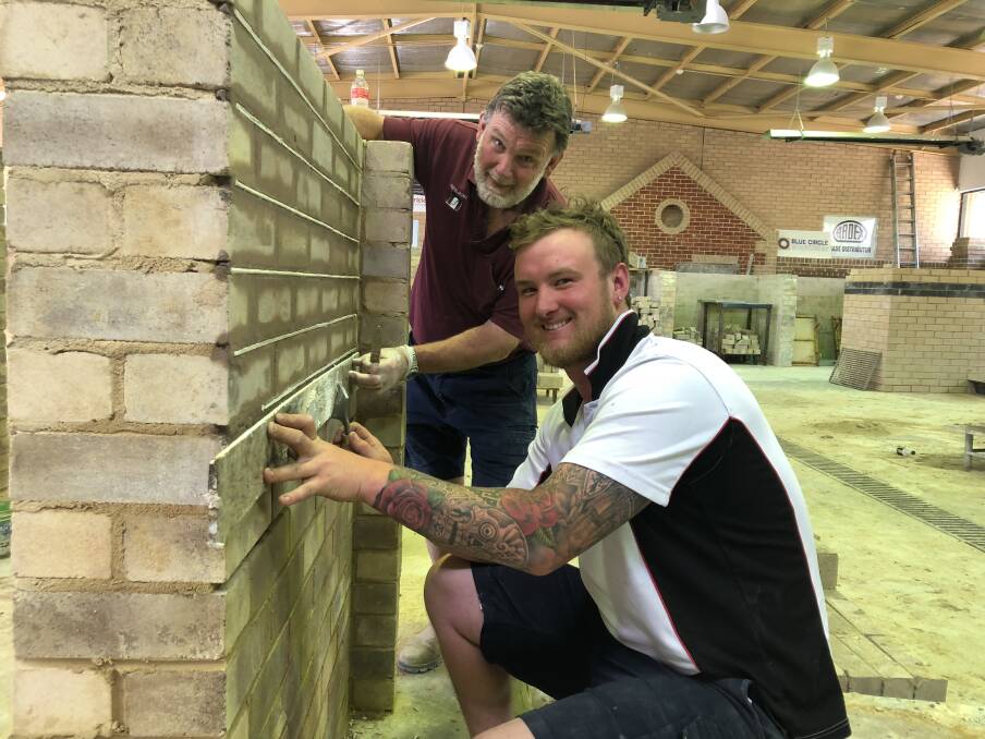 TAFE NSW bricklaying student Josh Mumberson with TAFE NSW teacher Peter Moore. Photo: supplied