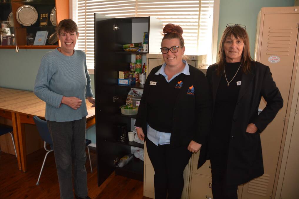 Gunnedah Good Noshery's Kate Perceval and Jobs Australia's Cassie Foody and Vicki Durham with the new pantry. Photo: Jessica Worboys