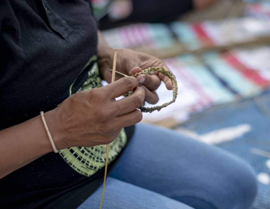 Traditional weaving being completed at the program.