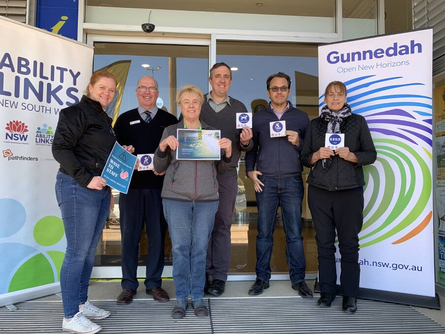 Gunnedah Access Working Group members with Gunnedah Shire Council staff and NSW Ability Links staff ready to place accessibility stickers at The Civic. Photo: supplied