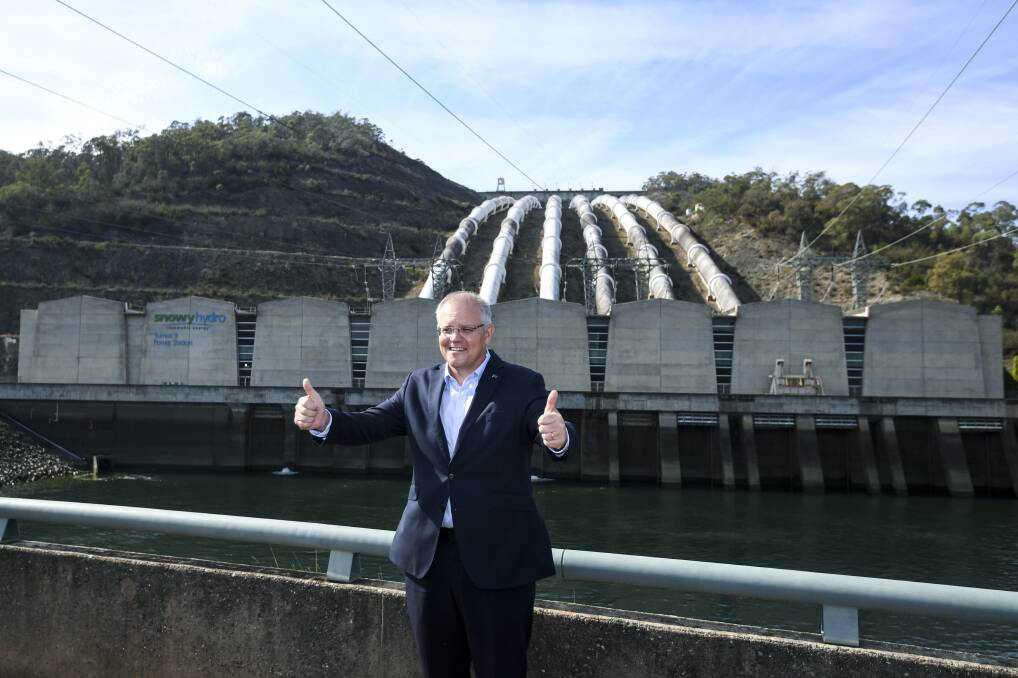 'Fair dinkum power': Prime Minister Scott Morrison in front of the Tumut 3 power station at the Snowy Hydro Scheme in Talbingo, on Tuesday where he announced a further $1.3 billion investment into the Snowy Hydro 2.0 project. Picture: Lukas Coch