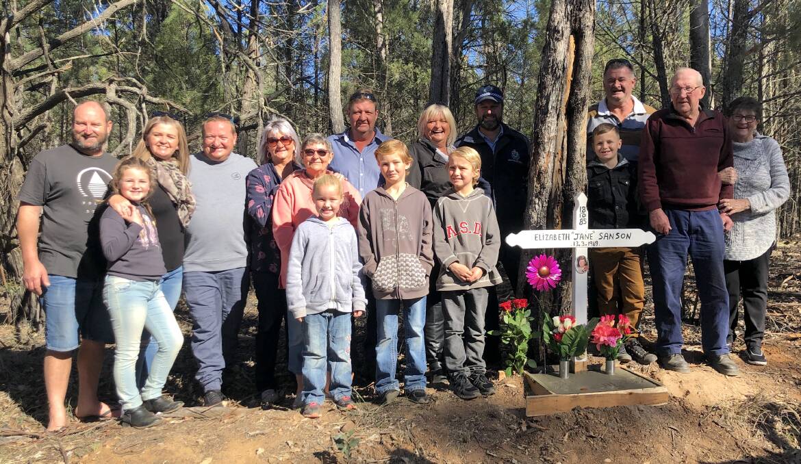 Moving: The family and friends of crash victim Elizabeth 'Jane' Sanson and Senior Sergeant Jason Bush gather at the new memorial to her. Photo contributed.