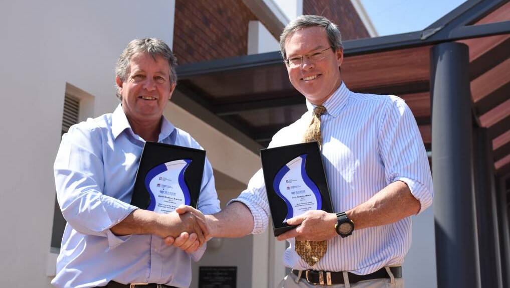 CLEAR MESSAGE: Water services manager, Kevin Sheridan, and former acting director of infrastructure services, Edward Paas, with water industry awards.