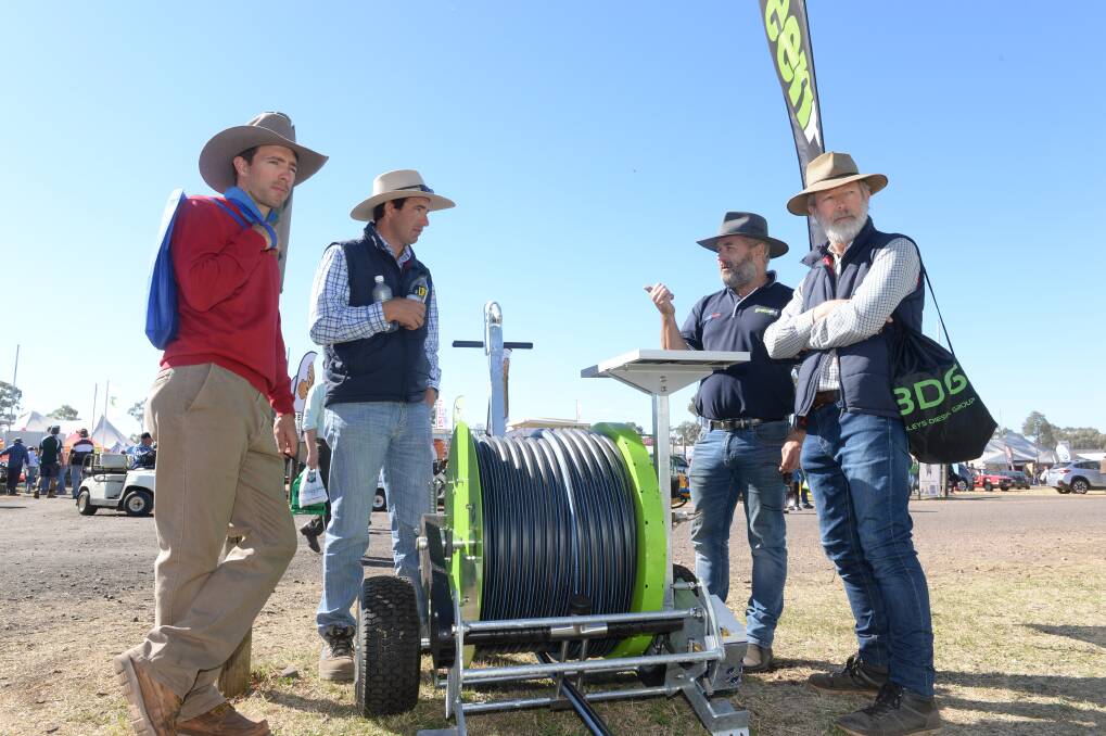 Ben Hestehauger, Greenpro, Sunshine Coast, talks to Samuel, Naason and Alan Jagoe, Iona Downs, Grafton, at last year's event. Buyers of bulky items are encouraged to use the parcel pick-up service.