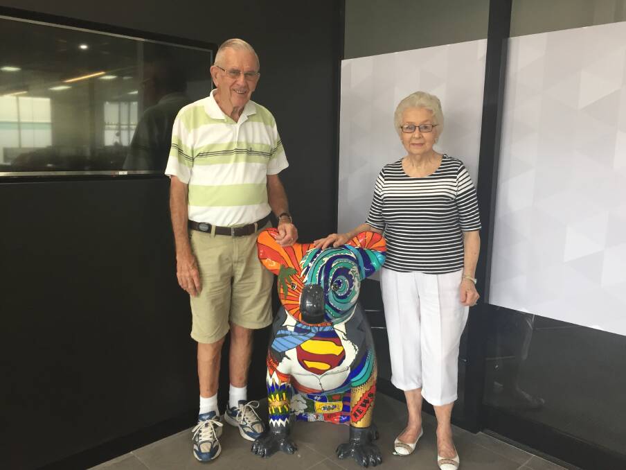 Holiday time: Rod and Pat Green pictured with Scoop, one of the Hello Koalas sculptures.