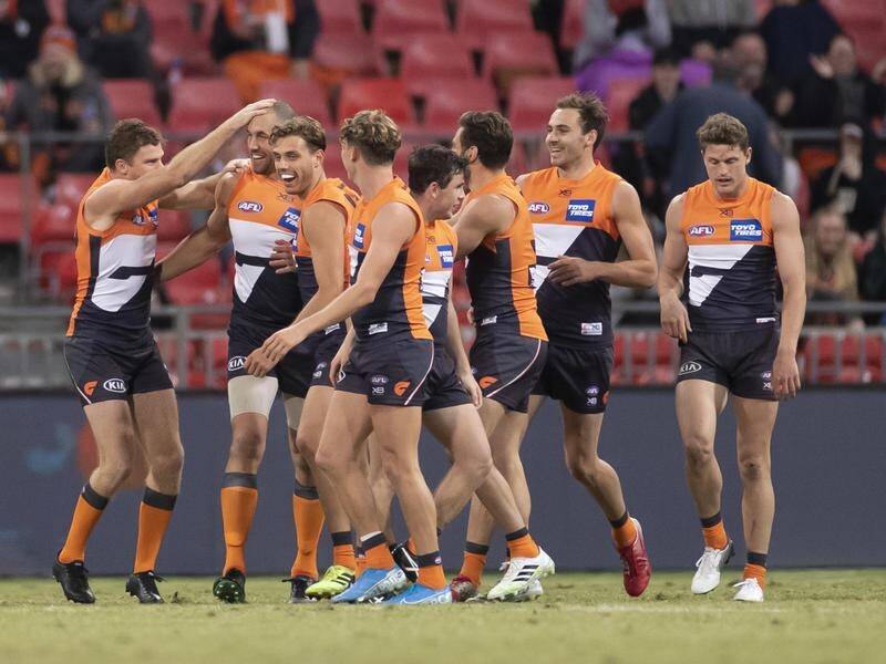 GWS Giants players celebrate during their 34-point AFL win over Hawthorn on Sunday.