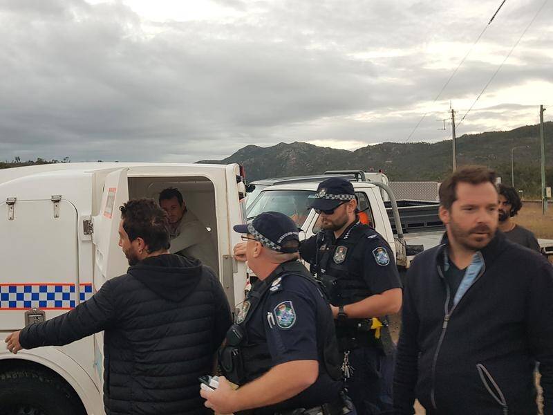 French journalists have been charged with trespassing at an anti-Adani protest in north Queensland.