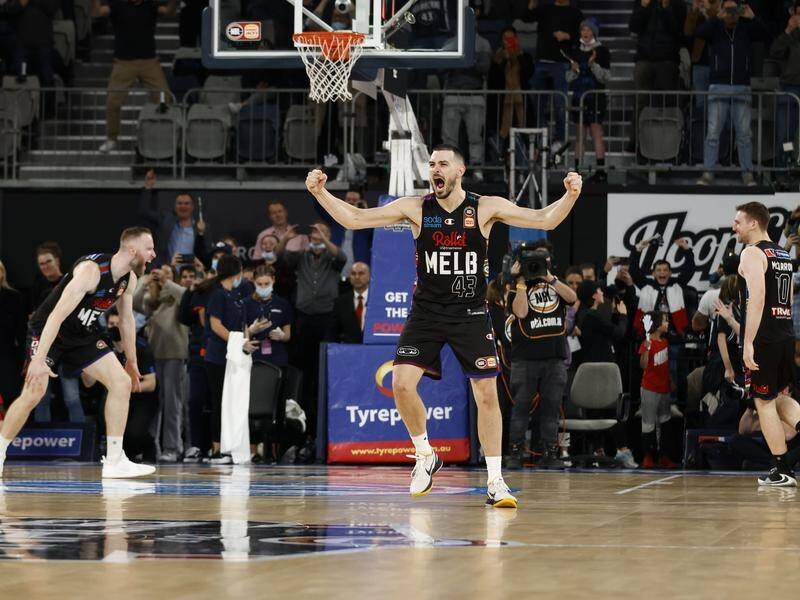 Captain Chris Goulding (No.43) leads the Melbourne United celebrations as time expires.