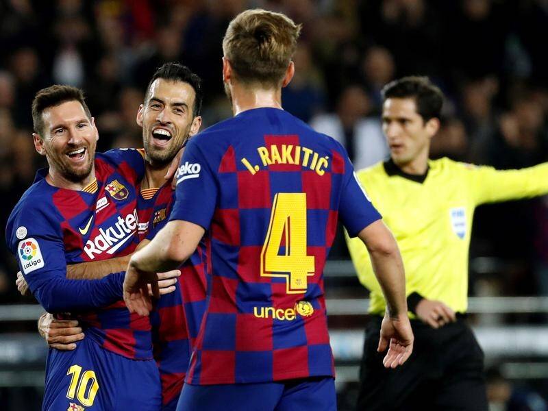 Barcelona's Lionel Messi (l) scored all three goals against Mallorca with brilliant left-foot shots.