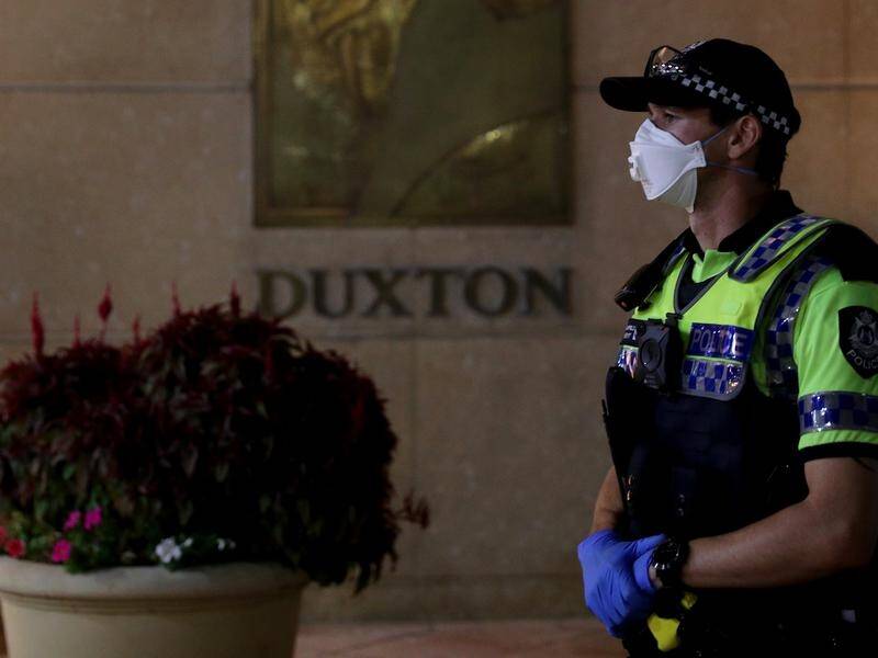 A union says security guards at virus quarantine hotels in Perth are being told to remove face masks