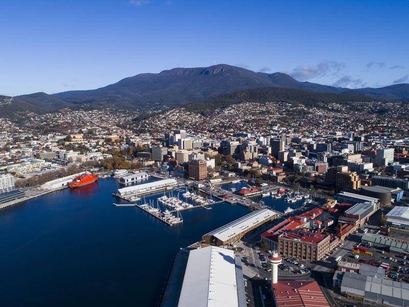 A coronavirus-infected man escaped hotel quarantine in Hobart via a fire escape, a review has found.