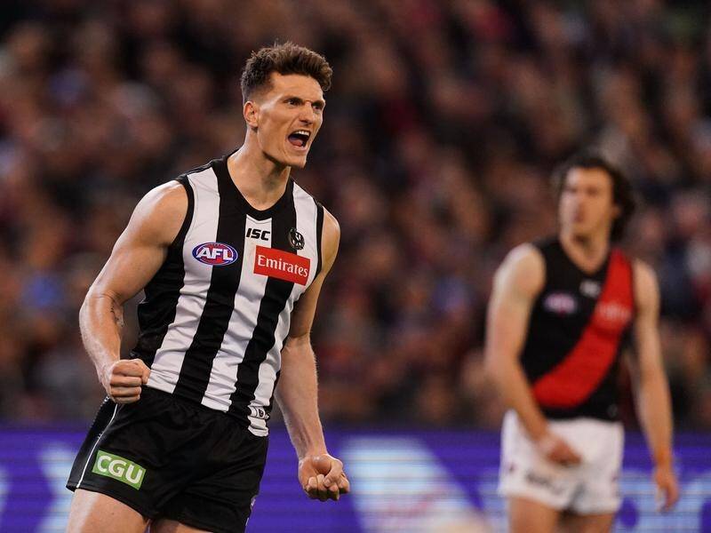 Brody Mihocek kicked four goals as Collingwood beat a depleted Essendon by 11 points at the MCG.