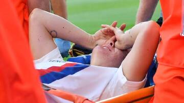 Australia's Ellie Carpenter has been carried off injured during Lyon's Champions League final win.
