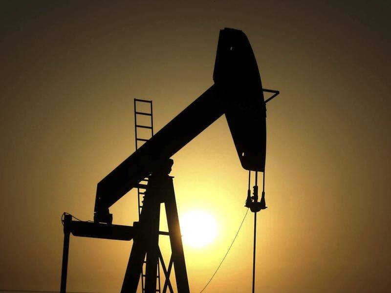 Oil prices fell but remained on track for a fifth consecutive weekly gain.