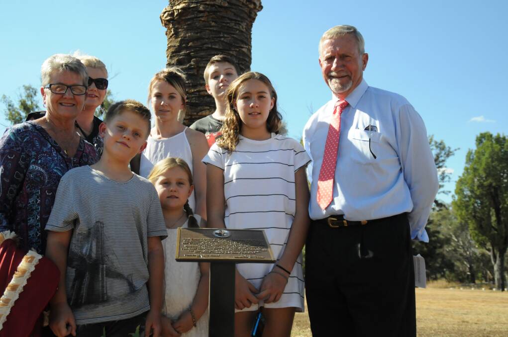 Mayor Owen Hasler with Hans Allgayer’s wife Joanne (left) and members of the family in front of the palm tree dedicated to Cr Allgayer.