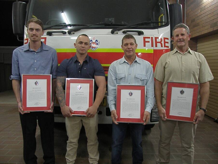 Jackson Ludlow, Jamie Fitzroy, Steve Smith and Brian Jaeger receive bravery awards for rescuing two people from a fire in February last year. 