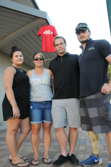 Helping out the family: (From left) Libby and Michelle Wicks with Josh Launders and Ed Howarth with an Alex Costello shirt hanging in the background. 