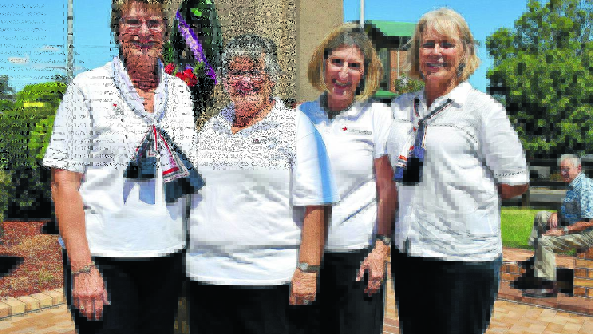 Tribute to our diggers: (From left) Lesley Mills, Renae Hooke, Ruth Strang and Robyn King from Gunnedah Red Cross at the cenotaph.