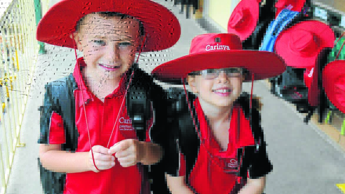 Fresh faces: Rory King and Emma Myers head into class for their first week of kindergarten at Carinya Christian School.