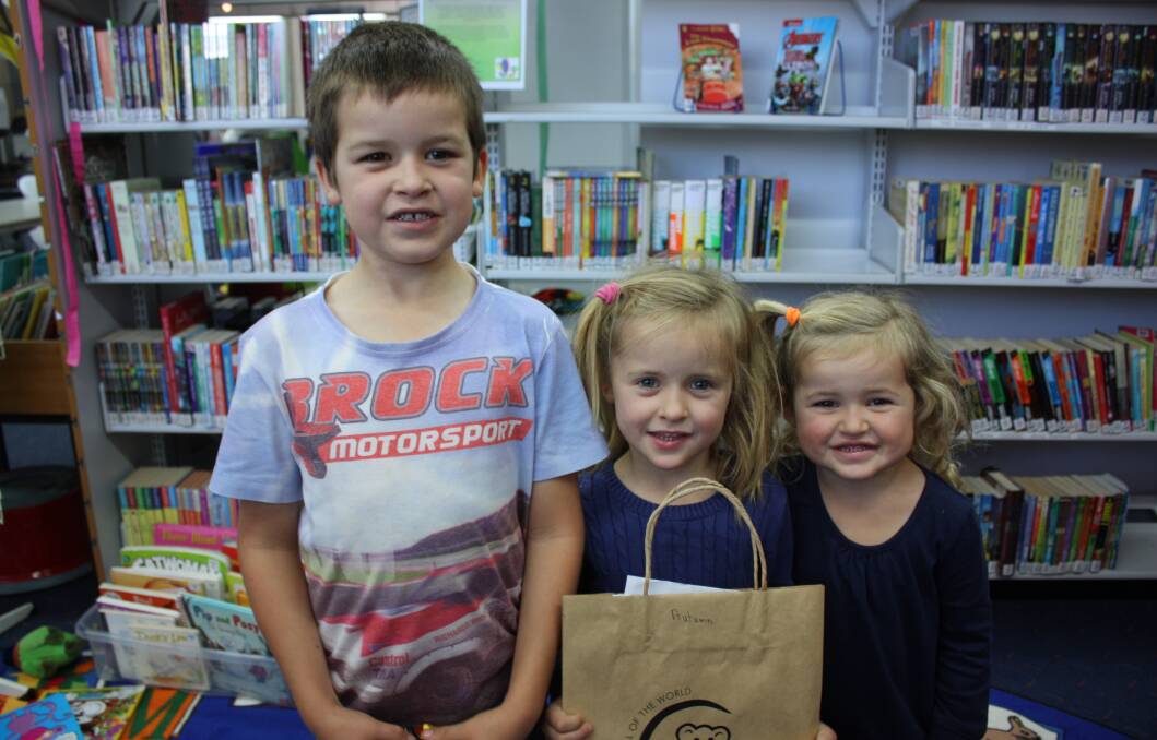 Harry, Maddison and Alex Thomson are looking forward to exploring the activity packs they received when they signed up for the new reading program 1000 Books After School.