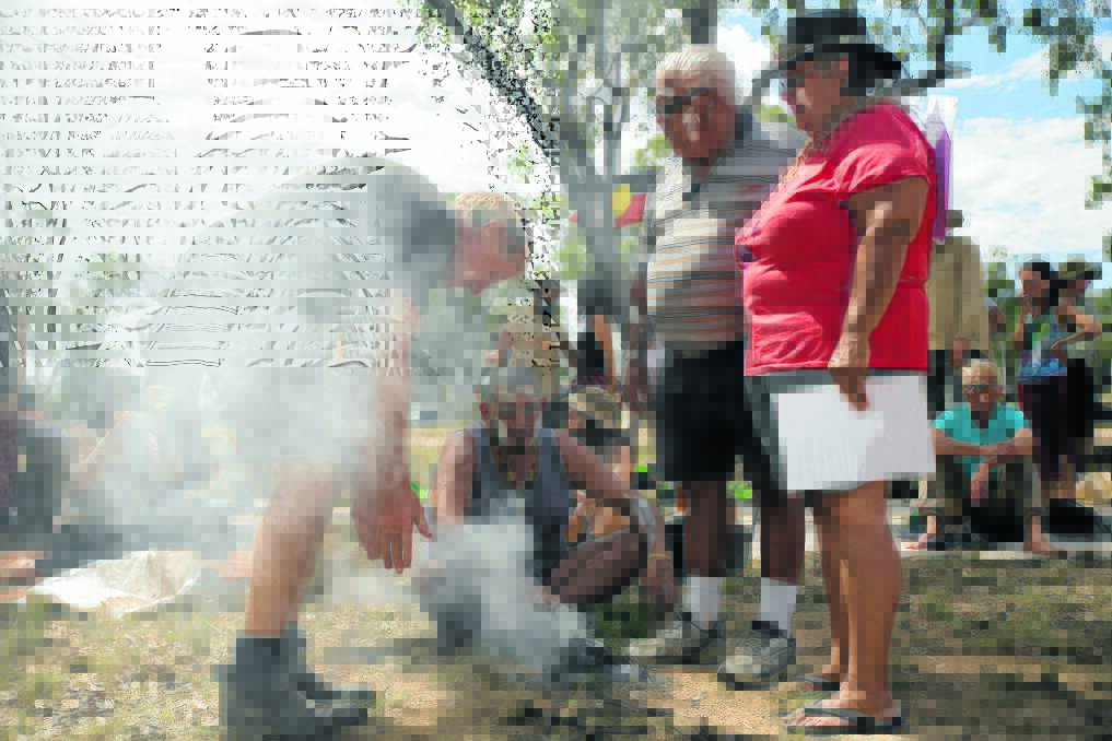 Emu ceremony: Gomeroi people hold a ceremony at the entrance to the Maules Creek mine yesterday. Photos: Jeff Tan