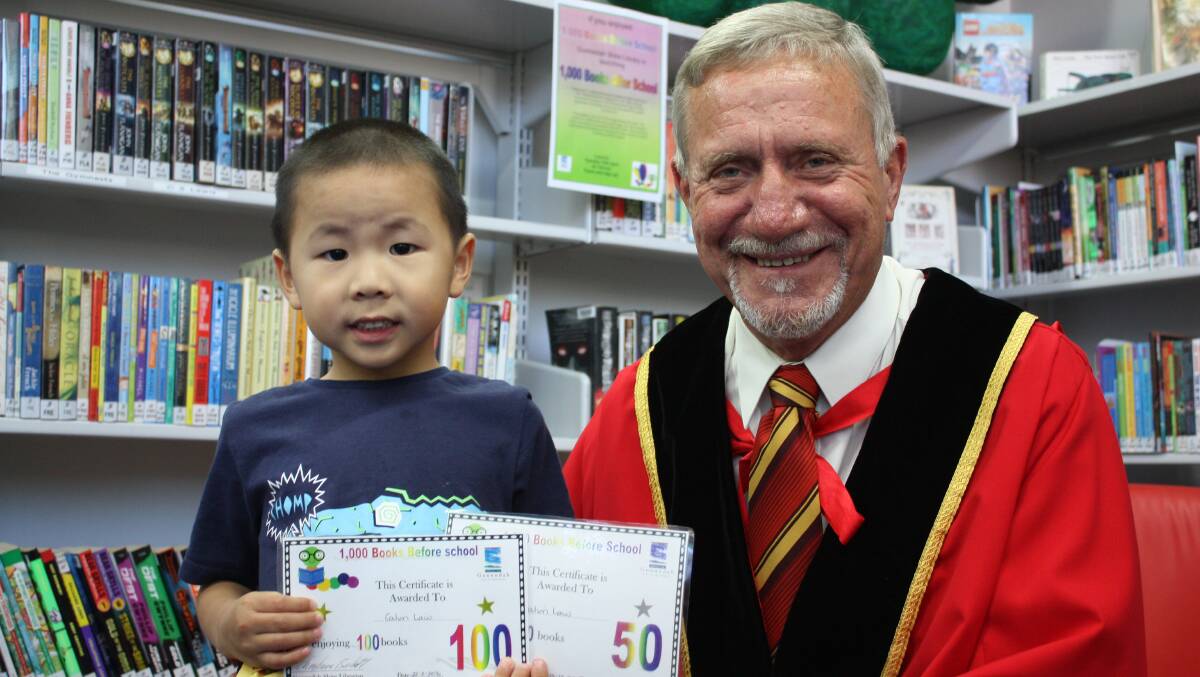 Calvin Law  is undertaking the 1000 Books Before School program for a second time. He is pictured here with Gunnedah mayor Owen Hasler.