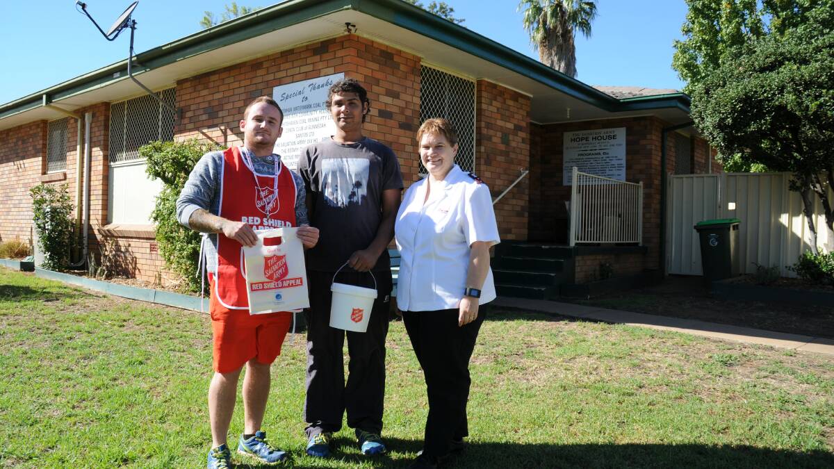 Ready for the doorknock: Korrye Stevens, Isak Conlan and the Salvation Army’s Captain Gaye Day.