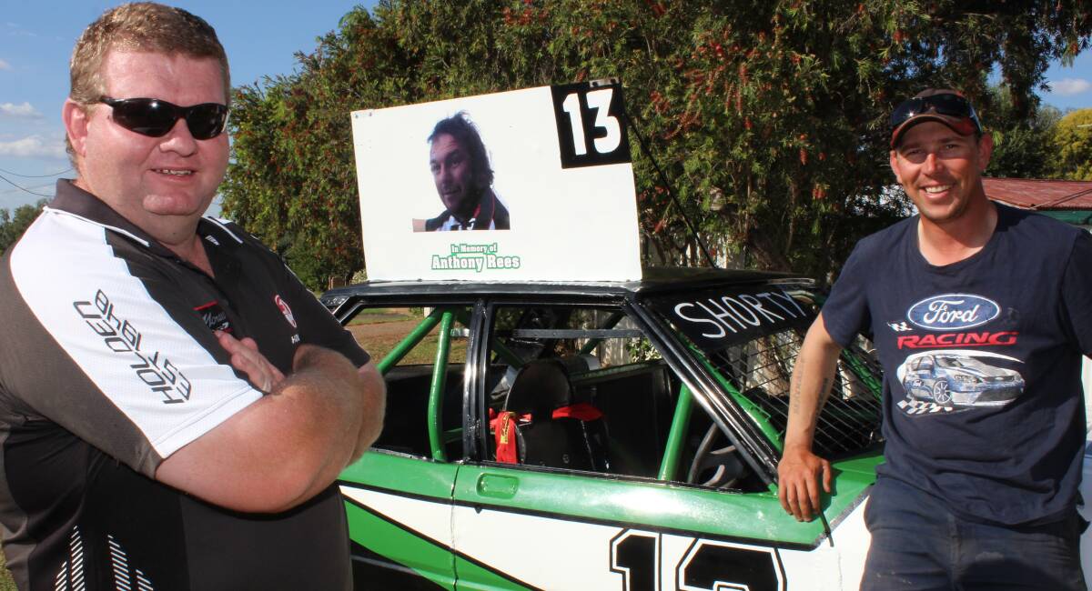 Anthony Rees brother David and Anthony’s best mate Glen McArthur with the tribute car Glen will race this weekend in the inaugural Anthony Rees Memorial at the Gunnedah Speedway.