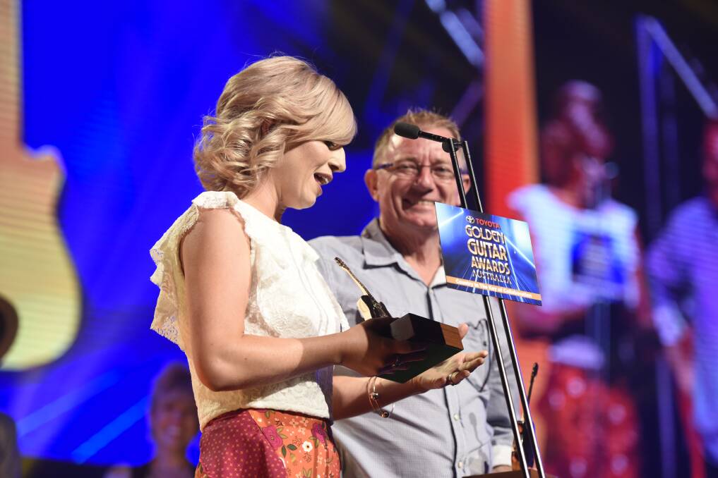 OVERWHELMED: Ashleigh Dallas and her father and producer, Brett, both received a Golden Guitar award for Traditional Album of the year. Photo: Peter Hardin 
