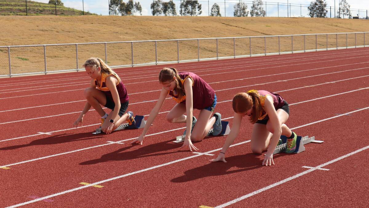 On your marks: NIAS sprinters at Sundays training session. Bella Sawyer, left, Ellie Thomas, middle, and Georgie Auld on the right. 