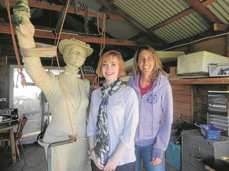 NEWCASTLE sculptor Tanya Bartlett (right) and Bowral’s Melissa McShane, with Tanya’s wax model of Mary Poppins ready for bronze casting.