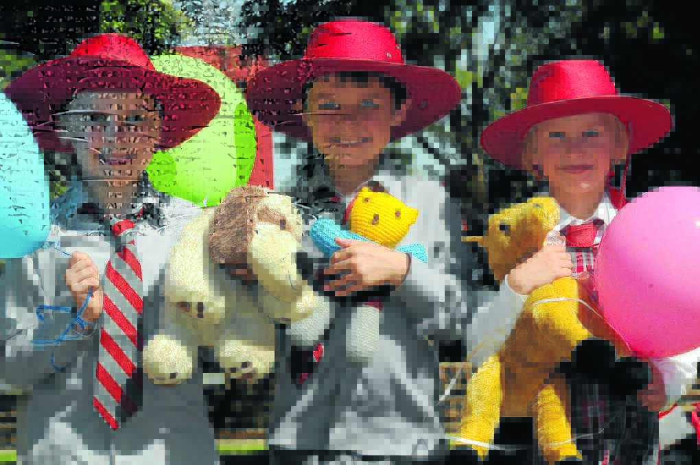 Gunnedah South Public School pupils at the Teddy Bear’s Picnic, from left, Nash Perry (6) with ‘Scruffy’ the dog, Clay Durrant (6) with ‘Rainbow” the teddy and Serena Jaeger (5) with ‘Shiney’ the horse.