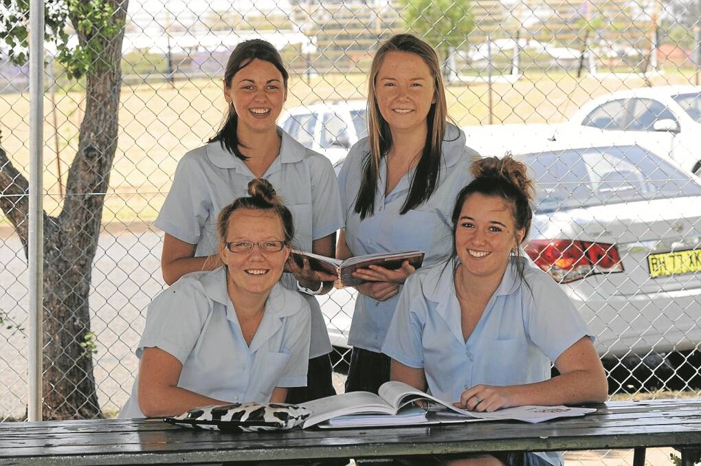 taking a seat after their Biology exam yesterday are Year 12 St Mary’s students Hannah Riordan, back left, and Emily Gilham, with Ashley Waterford, front, and Jess Somerville. It was the very last HSC exam for three of the girls.