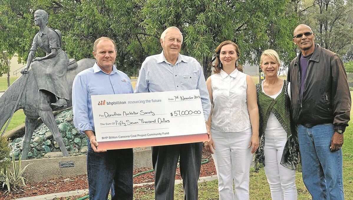 Stephen David, Caroona Coal’s Head of Projects, left, presenting a cheque for $57,000 to Dorothea Mackellar Memorial Poetry Society President John Pickett, project officer Mila Stone and members Marina Maas-Williams and Paul Williams.