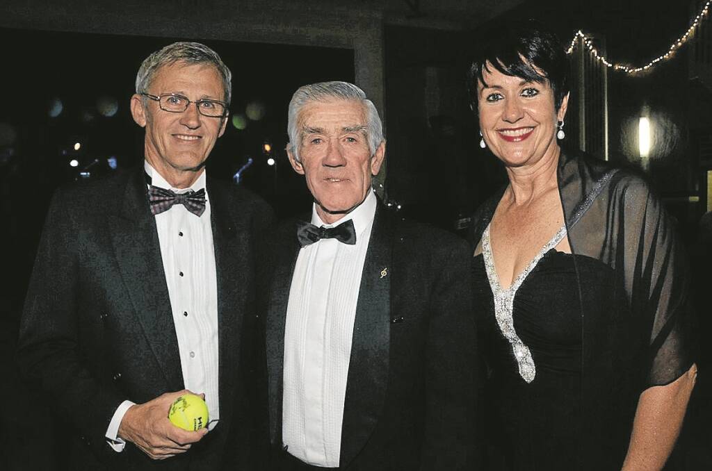 Ken Rosewall, centre, signed a tennis ball for Ken and Debbie Hartley.